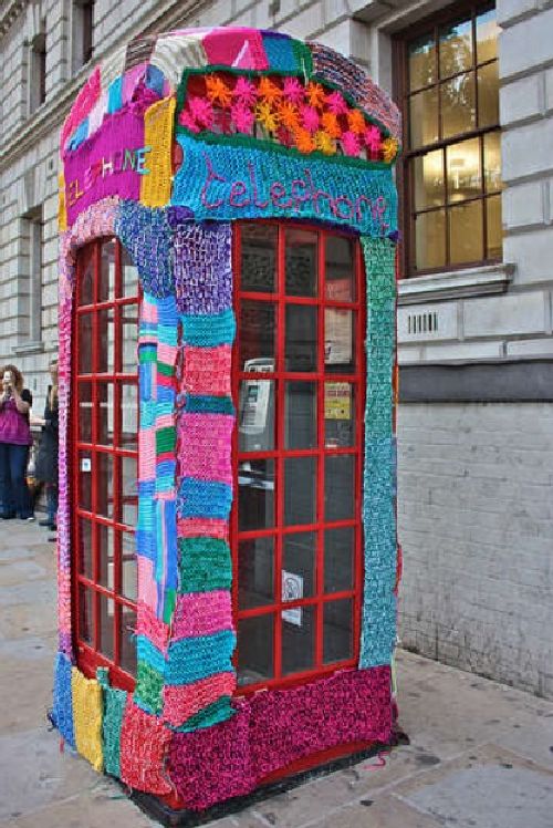 yarn bombed phone booth